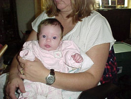 Mema holding Tristin at 2 months